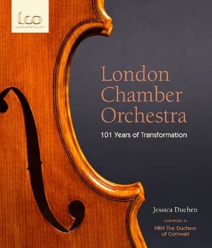 Front cover of a book showing a violin and the Title - London Chamber Orchestra 101 Years of Transformation